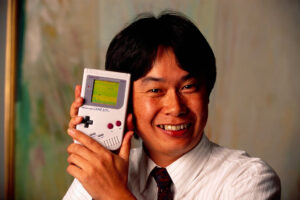 Shigeru Miyamoto Holding a Nintendo Game Boy