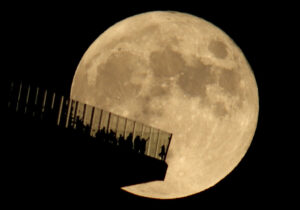 The Full Hunter's Moon Rises Behind EdgeNYC in New York City