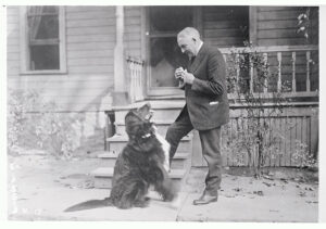 Warren G. Harding at home with dog
