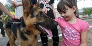 GettyImages-1235270256 dog and girl