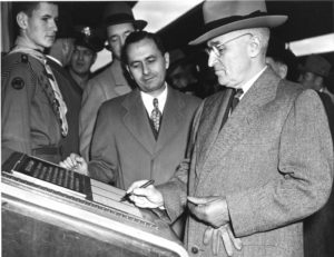 Photograph of President Harry S. Truman as He Signs the Guestbook of Freedom Train