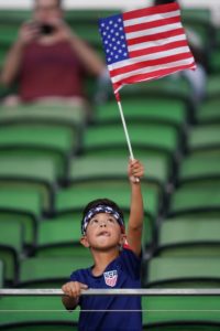 GettyImages-1404600346 boy holding flag